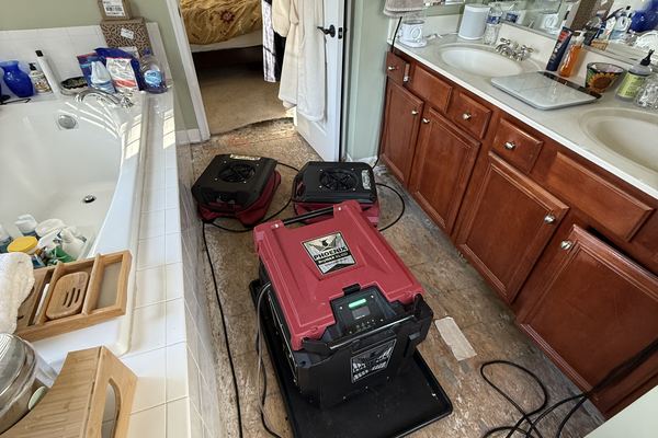 Bathroom water damage before photo - Ashburn, VA restoration company